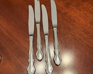W100 - $85. Oneida Dover 4-5 Place settings with 3 serving utensils. 