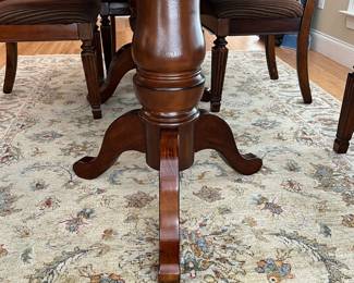 W12 - $300. Ashley Furniture Double Pedestal Table with 6 Chairs. Measures 42" wide x 70" x 30" tall. Has 1 leaf that can add another 18".  2 captains chairs - 4 regular. All sturdy and upholstery is in great condition!