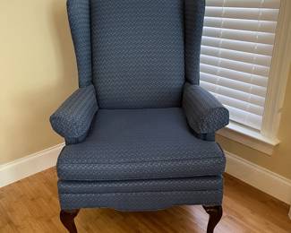W16 - $75. Blue Wing Back Chair. Measures 26" wide x 27" deep x 43" tall. Floor to seat is 19". Very good condition - upholstery & frame. Sturdy!