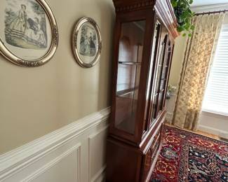 W72 - $150. American Drew Lighted China Cabinet - moves in 2 pieces. Measures 52" wide x 16" deep x 78" tall. Base is 27". Top is 51". Solid wood - very good condition with a few minor marks. 2 glass shelves - not adjustable. 