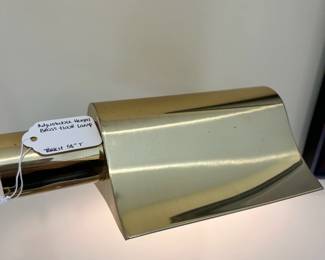 W60 - $50. Brass floor lamp. Adjustable height. Tallest 58" tall. Good condition. Some scuffs and a couple dents on the base.