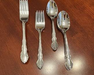 W100 - $85. Oneida Dover 4-5 Place settings with 3 serving utensils. 