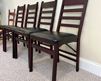 W54 - $40. Set of 4 Cosco *folding* chairs. Seat is 16.5" wide x 15" deep x 18" tall. Chair is 35" tall. Wooden Frame with padded seats. Very good condition! Sturdy & Comfortable for folding chairs. 