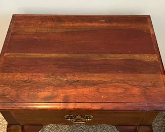 W22 - $45. Single End Table. Measures 22.5" wide x 17" deep x 26" tall. Top shows a bit of wear but overall sturdy and in good condition! Drawer slides easily. 