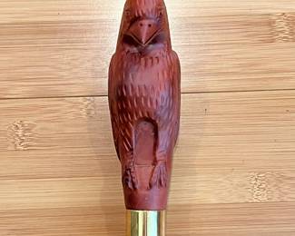 W24 - $50. Carved Eagle Cane with brass band. 