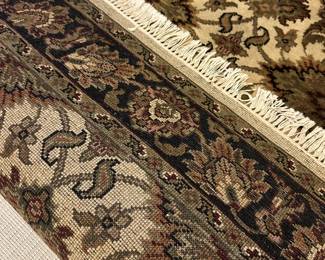 W99 - $100. Entry Rug feels like wool.  Measures 49" x 74". 