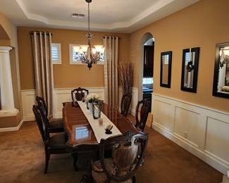 This dinning set site great in formal dinning rooms and add a touch of elegance to any home decor! Even the wall and decor are for sale!