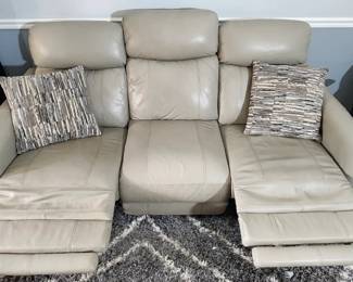 Leather electric reclining sofa (two recliners) with usb charging on the side. 