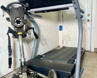 NordicTrack 5100 R foldable treadmill and a bag boy golf bag carrier

