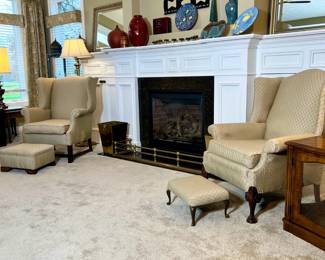 two wing back chairs and ottoman

