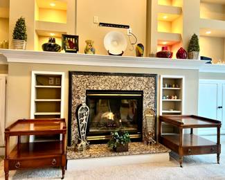 two matching tables, various decor on mantle

