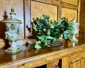 two decorative urns with lids

