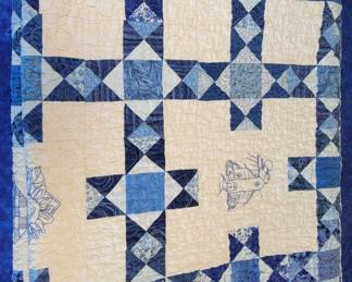 Quilt, pieced and hand embroidered.