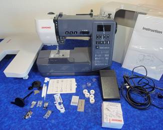 Janome TravelMate 50. Includes extension table, presser feet, walking foot, bobbins, instruction manual, case, accessories. Box included, only used 3 days,
