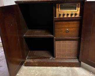 Vintage phonograph/radio cabinet. Radio works, phonograph was working, wire possibly loose