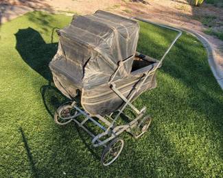Antique baby carriage, operates well, some fraying.