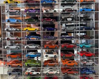 69 Hot Wheels in Display Case Multiple generations of the Ford Mustang, Chevrolet Camaro, Dodge Challenger and Charger 