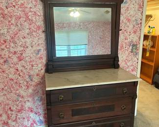 Antique Marble Top Dresser
Great condition!
Drawers slide well, however, top drawer does not slide completely in.
42” across x 20” deep x 34” to top of dresser, 79” to top of mirror
Mirror is removable from dresser 
Must be able to move and load yourself