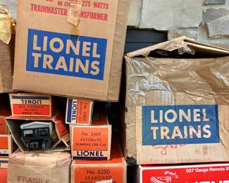 We have several vintage Lionel train boxes, including a Type ZW Trainmaster Transformer box and other accessories and car boxes. These items are part of Lionel's post-war era collection. 