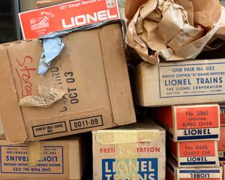 A collection of vintage Lionel model train boxes. 