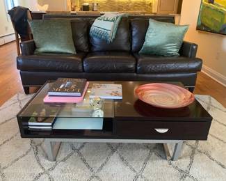 Contemporary, Clear, Black Lucite w. Chrome Pull handles / Brown Leather Sofa Chairs. Bloomimgdales 