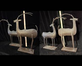 Metal antelope sculptures. Approx 24" high.  Base is 12" long.  Pair of two.  Excl cond.  $100