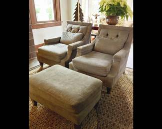 Baker Furniture's Thomas Pheasant Club Chairs with matching accent pillows. Tufted pillow back with tapered legs and decorative brass tack nail head borders. Fabric is an ash-brown color. Set of Two chairs and one ottoman. $1200