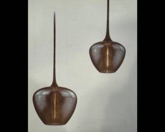 Set of bronze pendants from the West End Collection.  
Set of TWO.  NEW and in original boxes . Smoked glass &  vintage bronze finish.  16”w x 21”h (with variable hanging lengths)   $695
