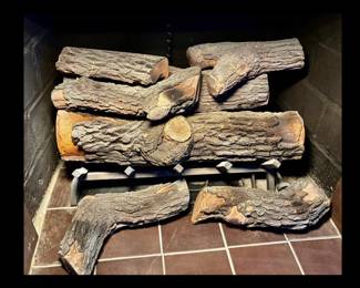24" Gas log set with grate.  Seven logs. $75