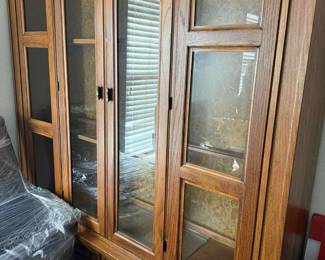 Beautiful china cabinet, multi doors, lots of storage beautiful warm oak color.