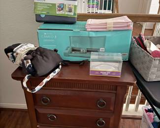 Drawers, Silhouette Machine and storage totes. 