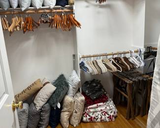 View of the closets with throw pillows and blankets