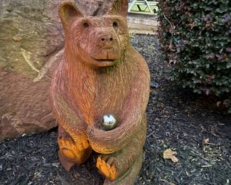 A cute wooden bear sculpture 