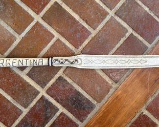 Argentinian&nbsp;rebenque&nbsp;(riding whip) or&nbsp;fusta&nbsp;(crop), featuring intricate rawhide braiding and the name "ARGENTINA" inscribed on the handle