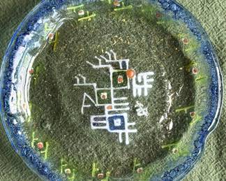 Decorative fused glass dish featuring an abstract design, likely representing Chinese characters 