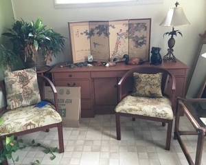 Chairs. Desk. Oriental decor. Lamp. Plants.