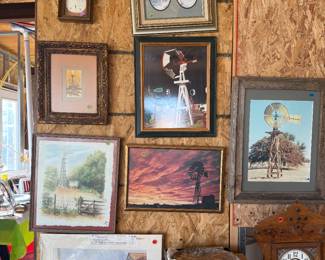 Windmill pictures, collectible plates, tabletop clock.