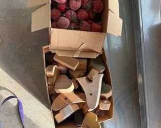 Box of apples, box of wooden blocks hearts etc.