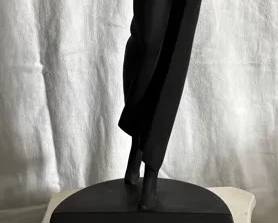 Female Golfer On Column