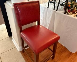 Single red chair with nailhead accents