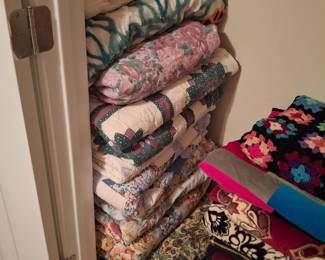 An unbelievable amount of blankets and quilts