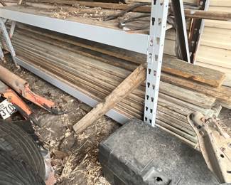 LARGE STACK OF LONG LUMBER