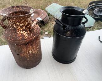 LOTS OF MILK CANS AROPUND HERE!