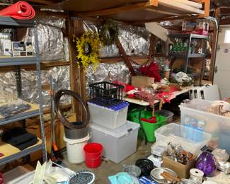The garage is a mix match of everything Christmas hardware, tubs, tools, garden, garden tools, good, big garage