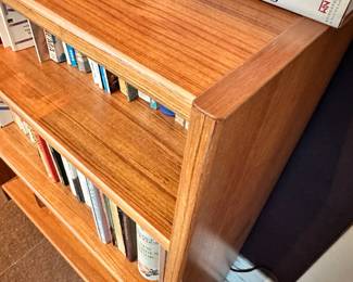 A library of teak bookshelves, many made in Denmark.