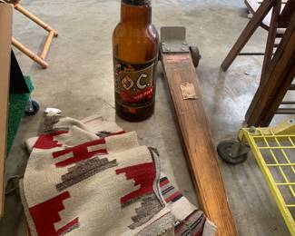 blankets and glass coin bottle