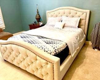 Striking tufted upholstered queen bed