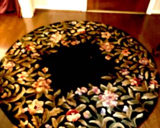 Round black floral rug