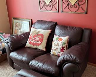 Fine Leather sofa with recliner on one side.