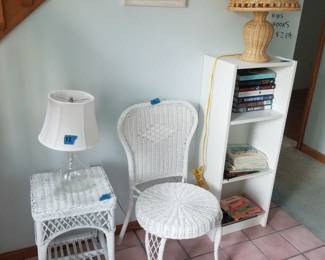 Wicker table & chair; table lamp; bookcase; books